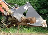 Lifting wood with Multi-Purpose 4-in-1 Bucket